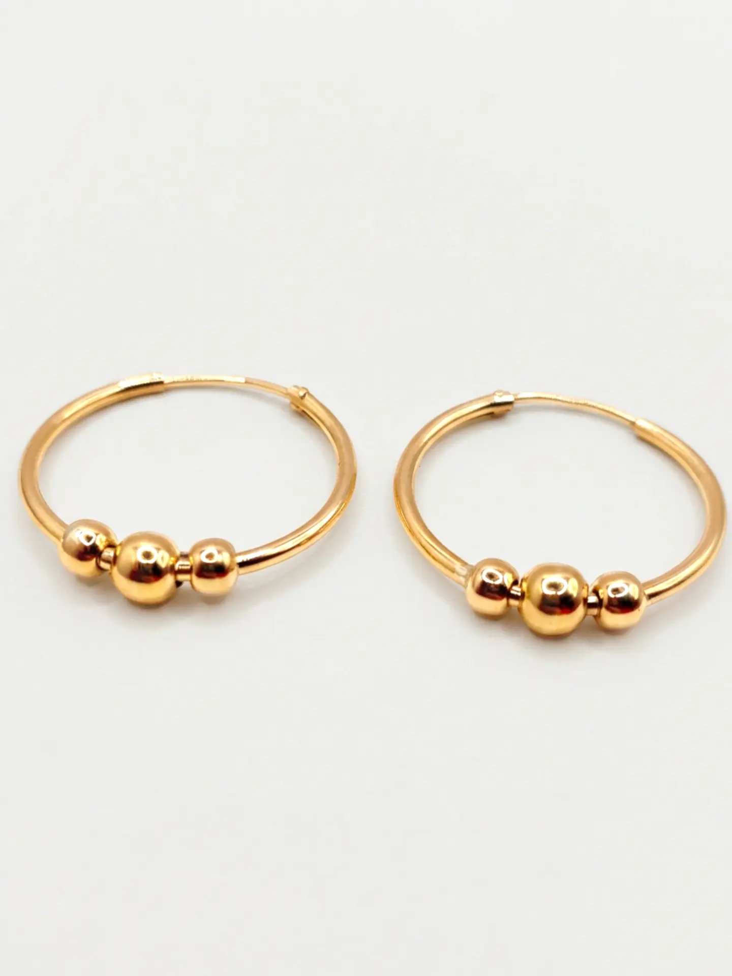 Aros Tubulares con Esferas de Gala Oro 18k 1