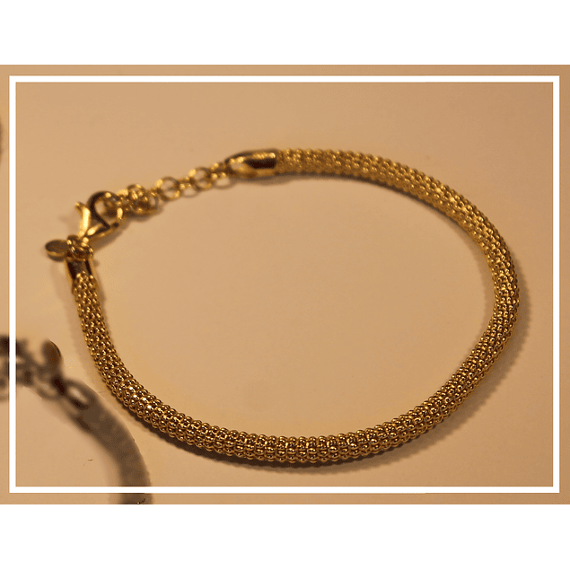 Pulsera en plata tejida con bano oro 18k