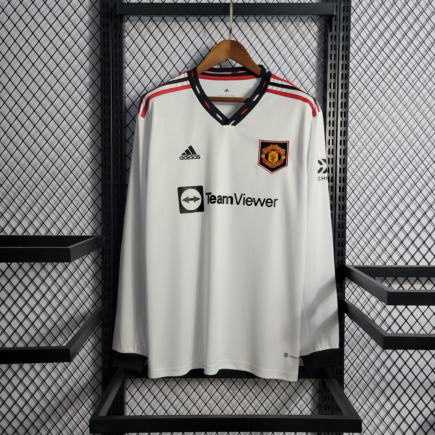 MANCHESTER UNITED AWAY 22-23 MANGA LONGA 1