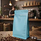50 Bolsas Doypack 13x20x7 cm Metalizadas Color Celeste con Válvula para 250 Grs. de Café - Miniatura 3