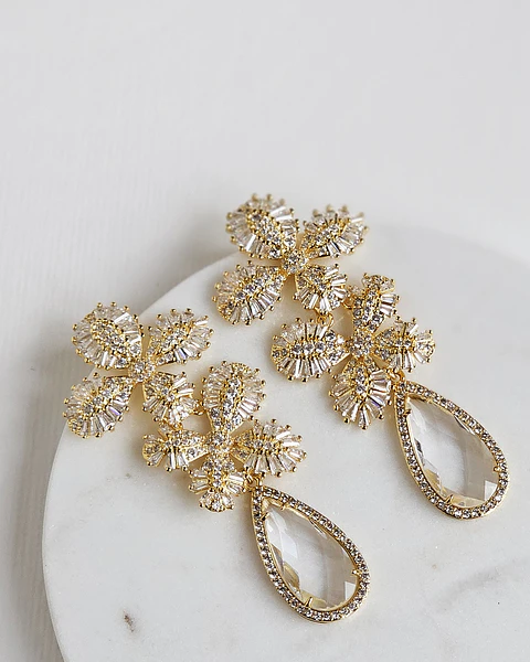 Aros de doble flor de circonitas y cristal dorado