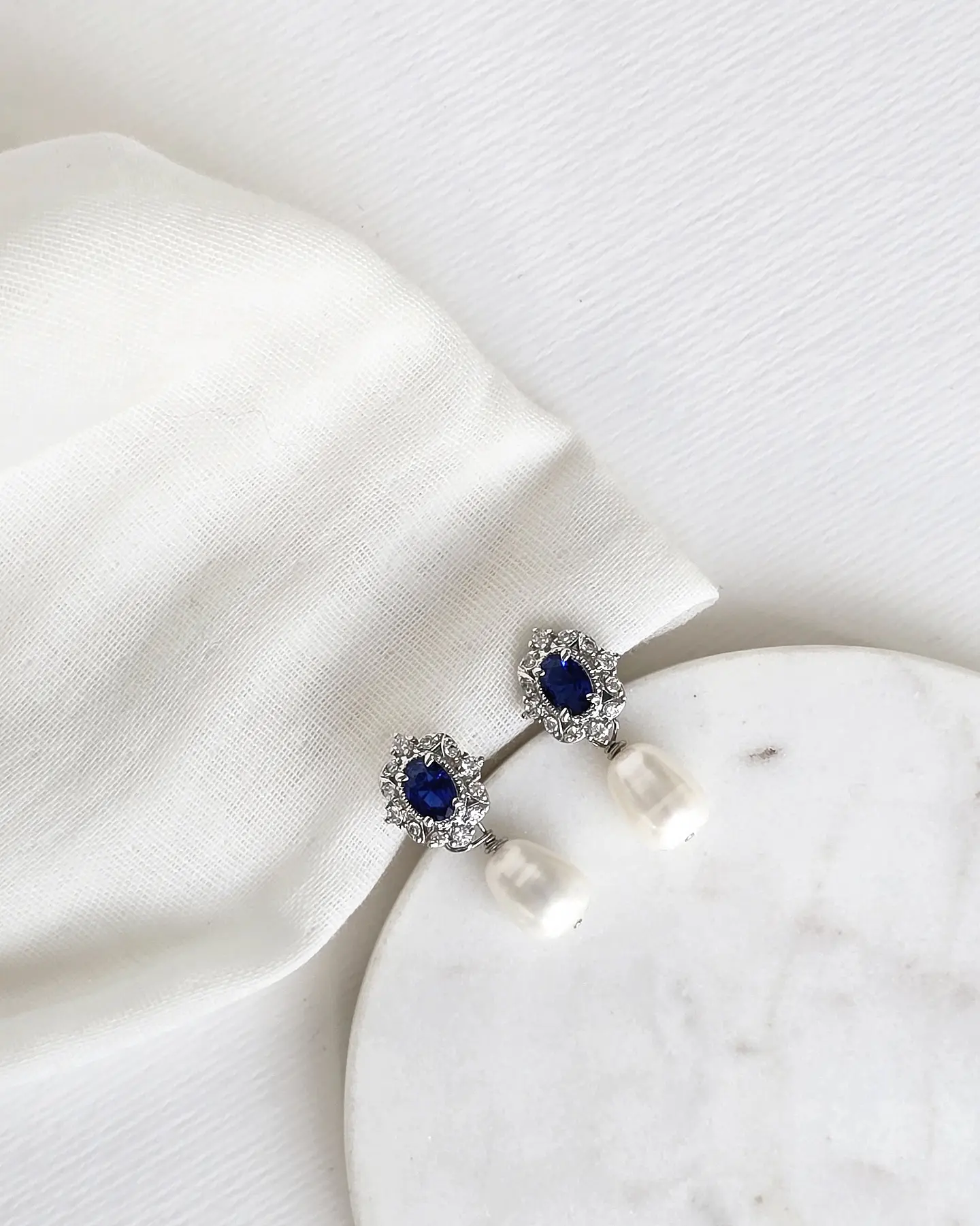Aros circonitas con cristal azul y perla natural 2