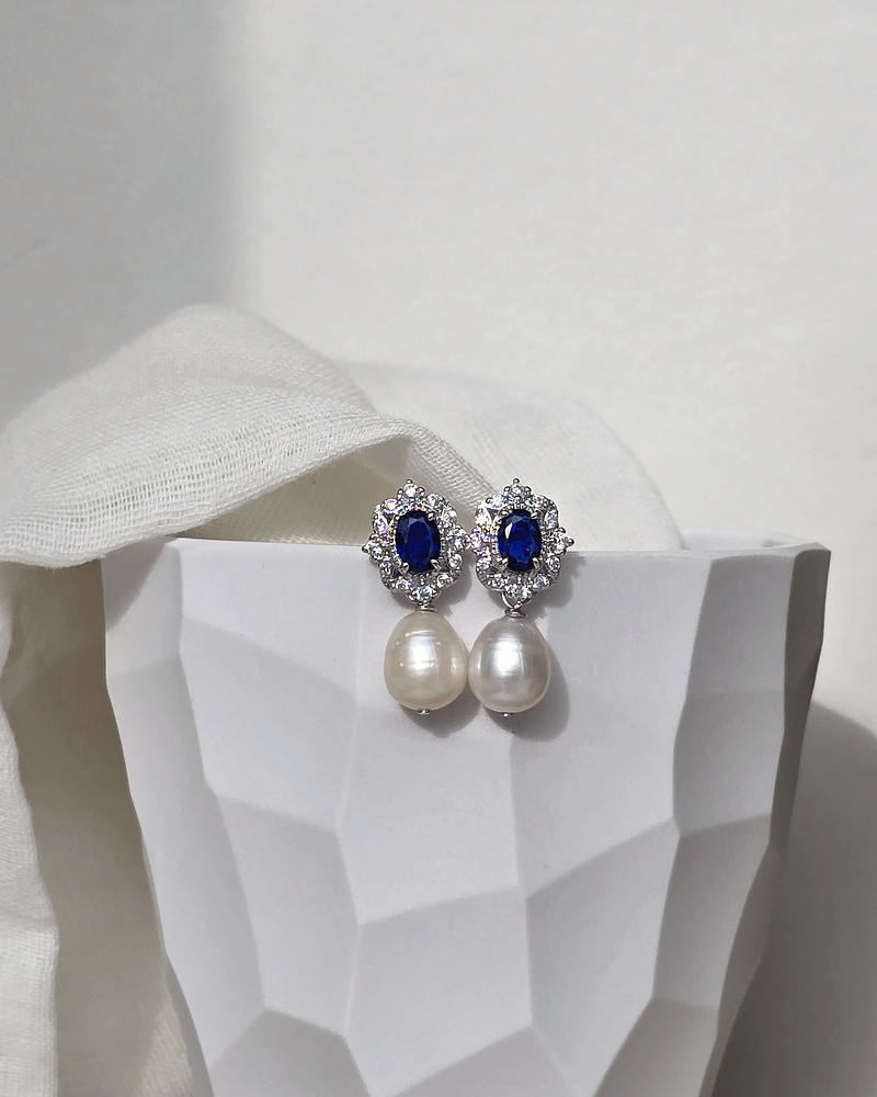 Aros circonitas con cristal azul y perla natural