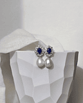 Aros circonitas con cristal azul y perla natural
