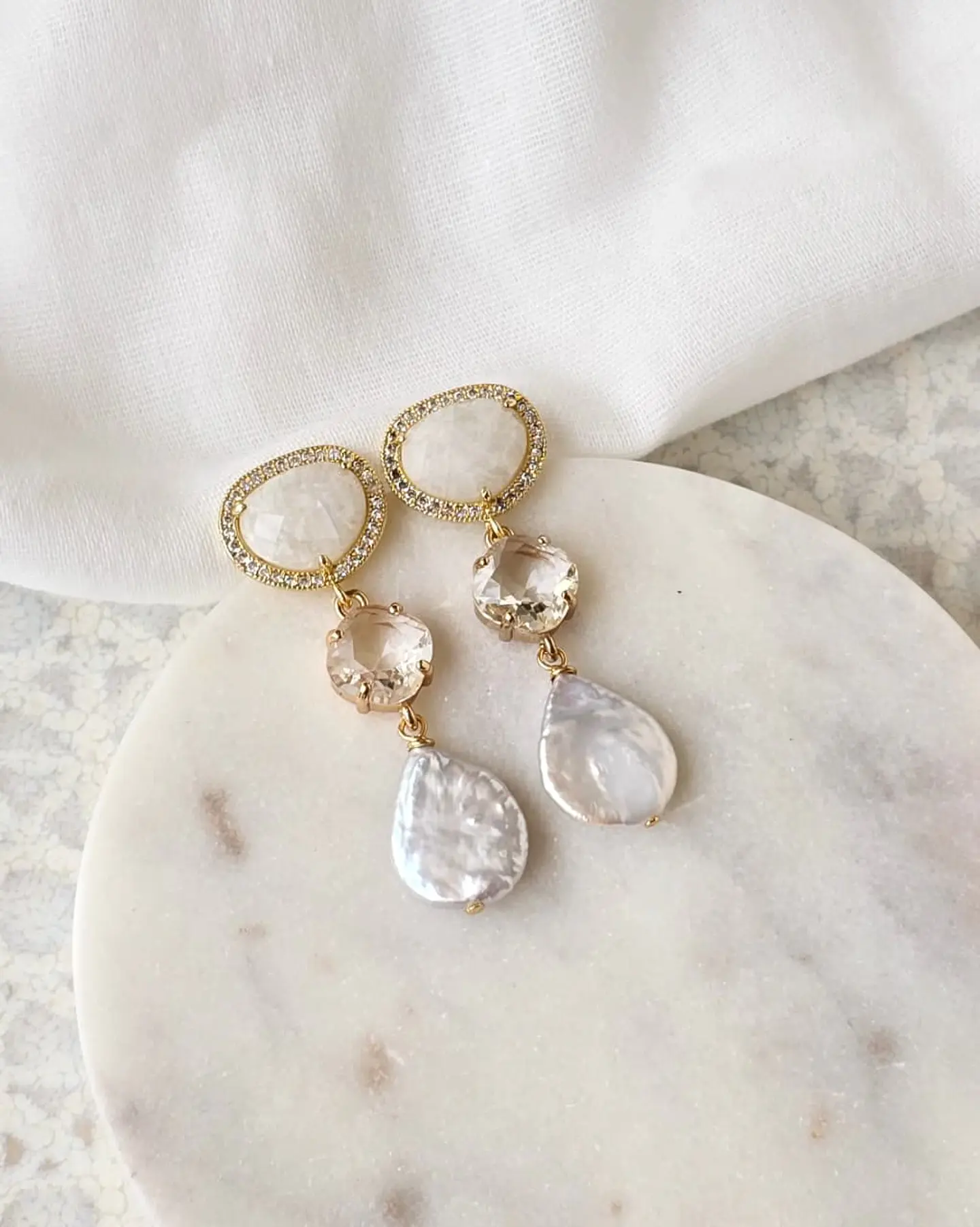 Aros cristal blanco, transparente y perla natural 1