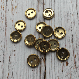 Set botones metálicos dorados