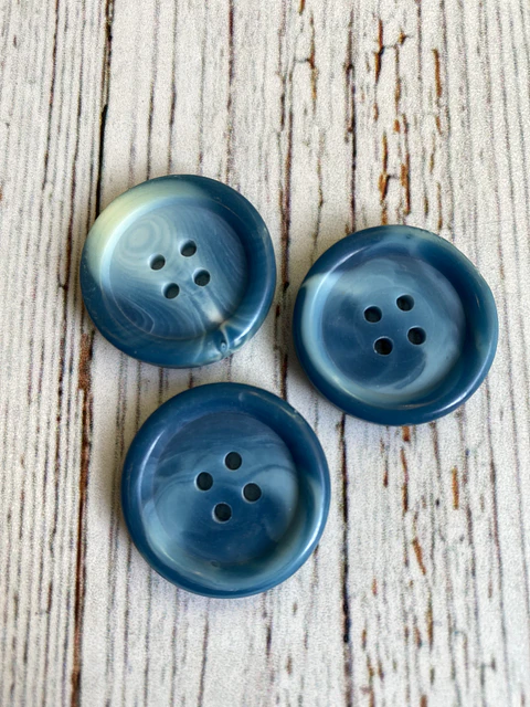 Botón marmoleado azul