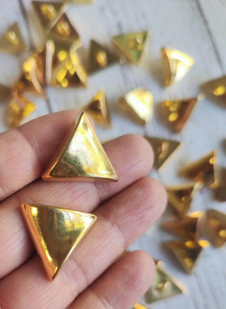Botones Triángulos dorados unidad 1