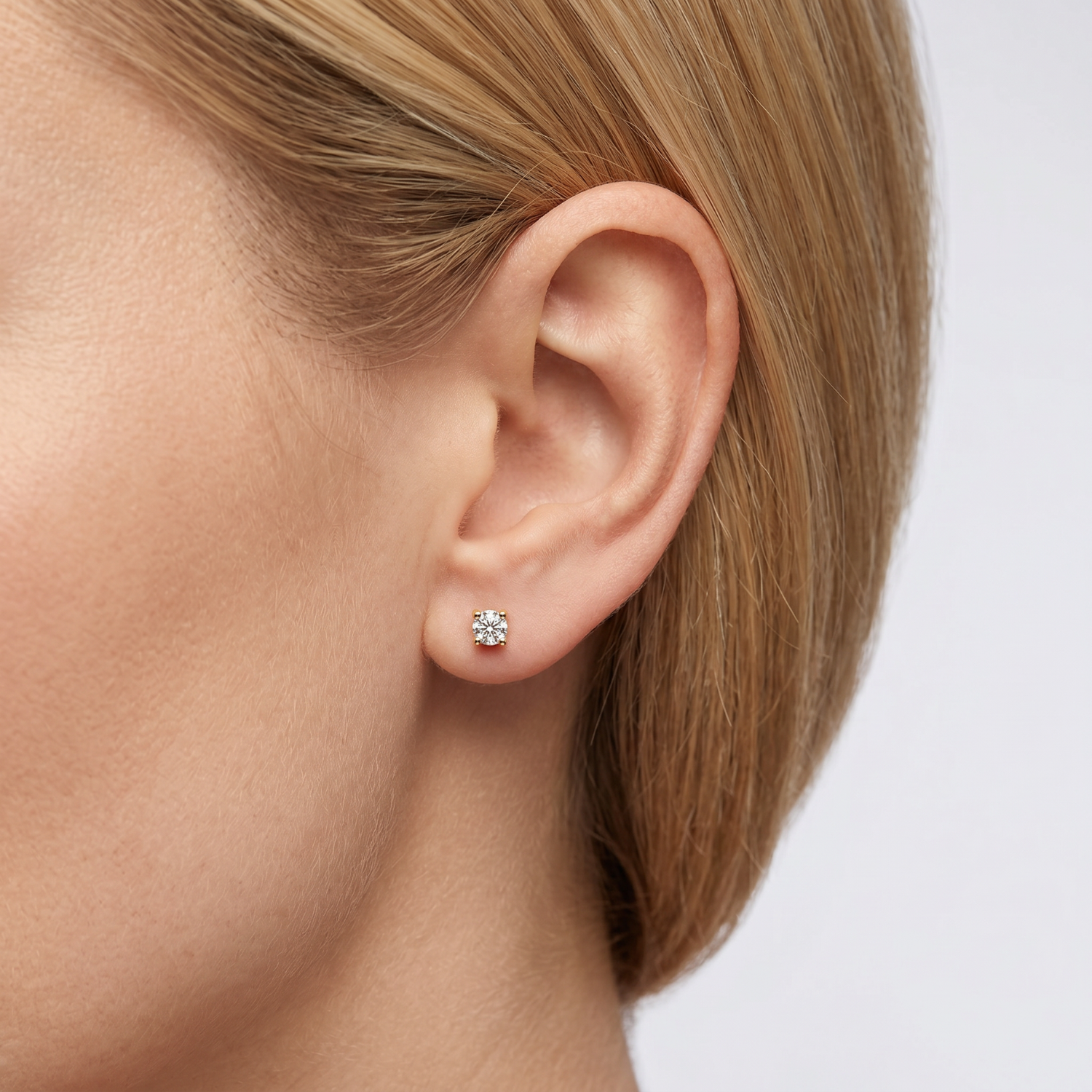 Aros de Oro 18kt con Diamantes Punto de Luz Grifas 6pts total SI/H 3