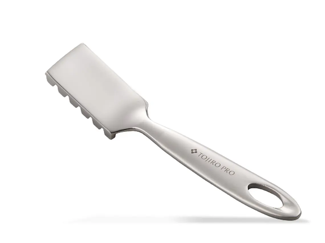 Quitaescamas de pescado. 1