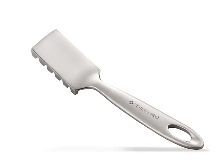 Quitaescamas de pescado. 1