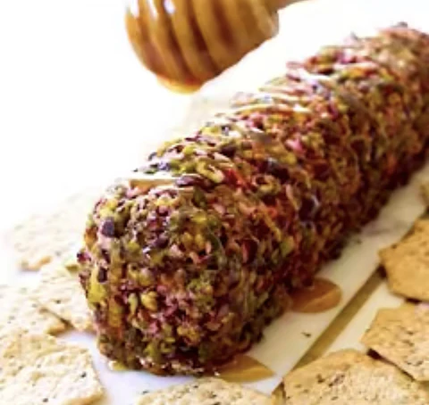Rolls de queso crema  con cramberries , Pistacho y miel