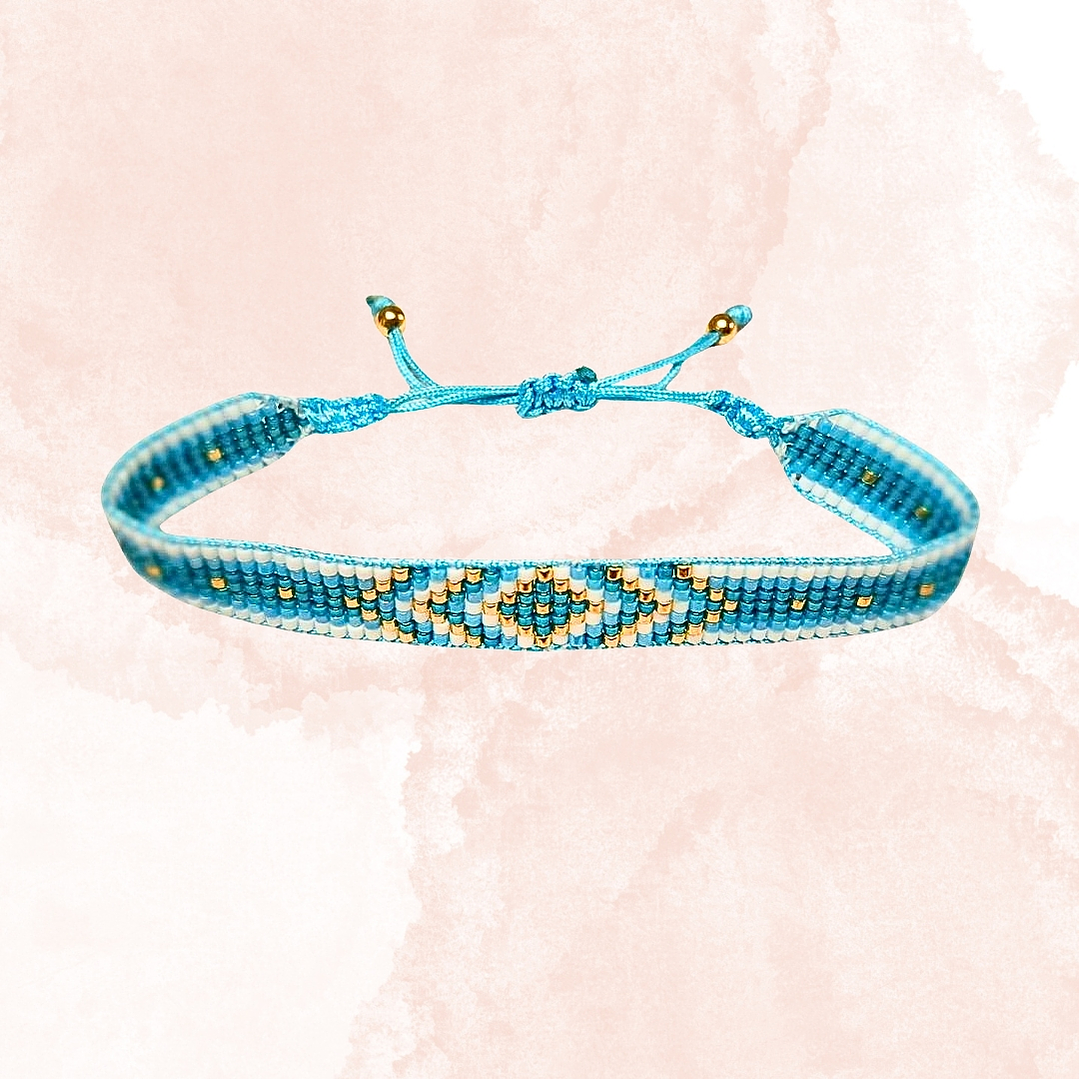 PULSERA FLECHAS CELESTE Y DORADO 1