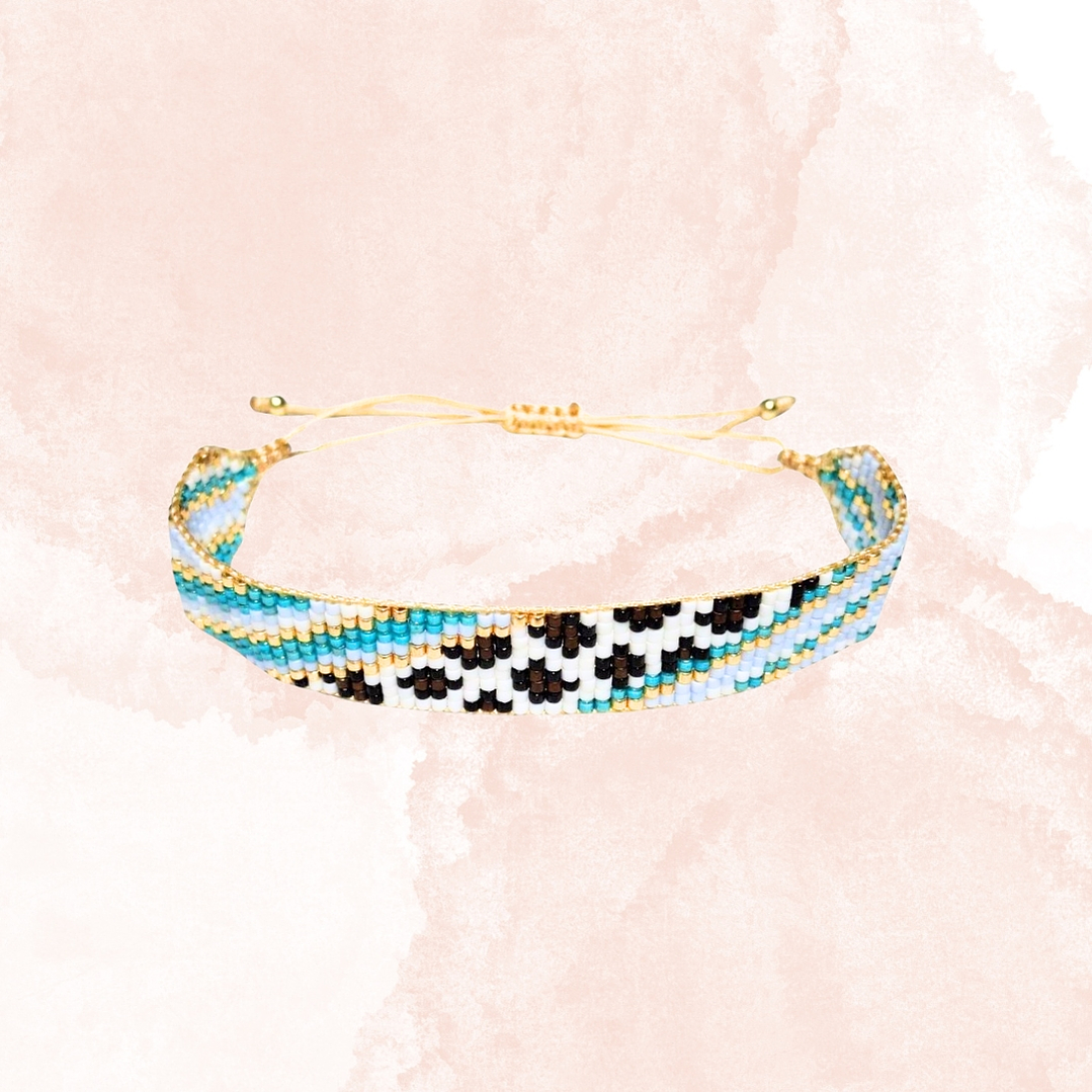 PULSERA  LEOPARDO TURQUESA Y DORADO 1