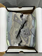 Jordan Retro 4 Kaws Gris  - Miniatura 1