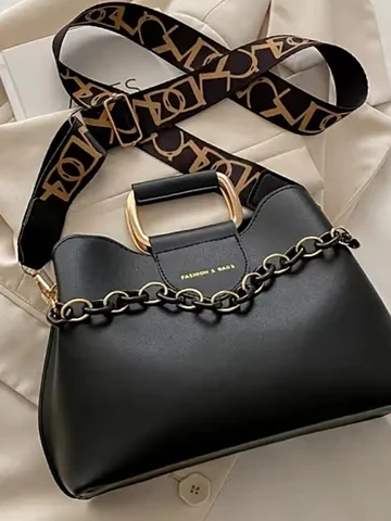 Cartera negra pasador plateado
