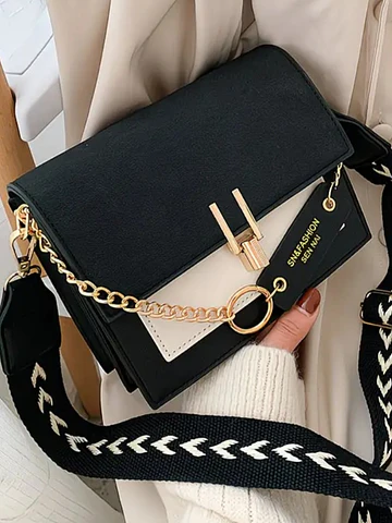 Cartera bicolor detalle dorado 