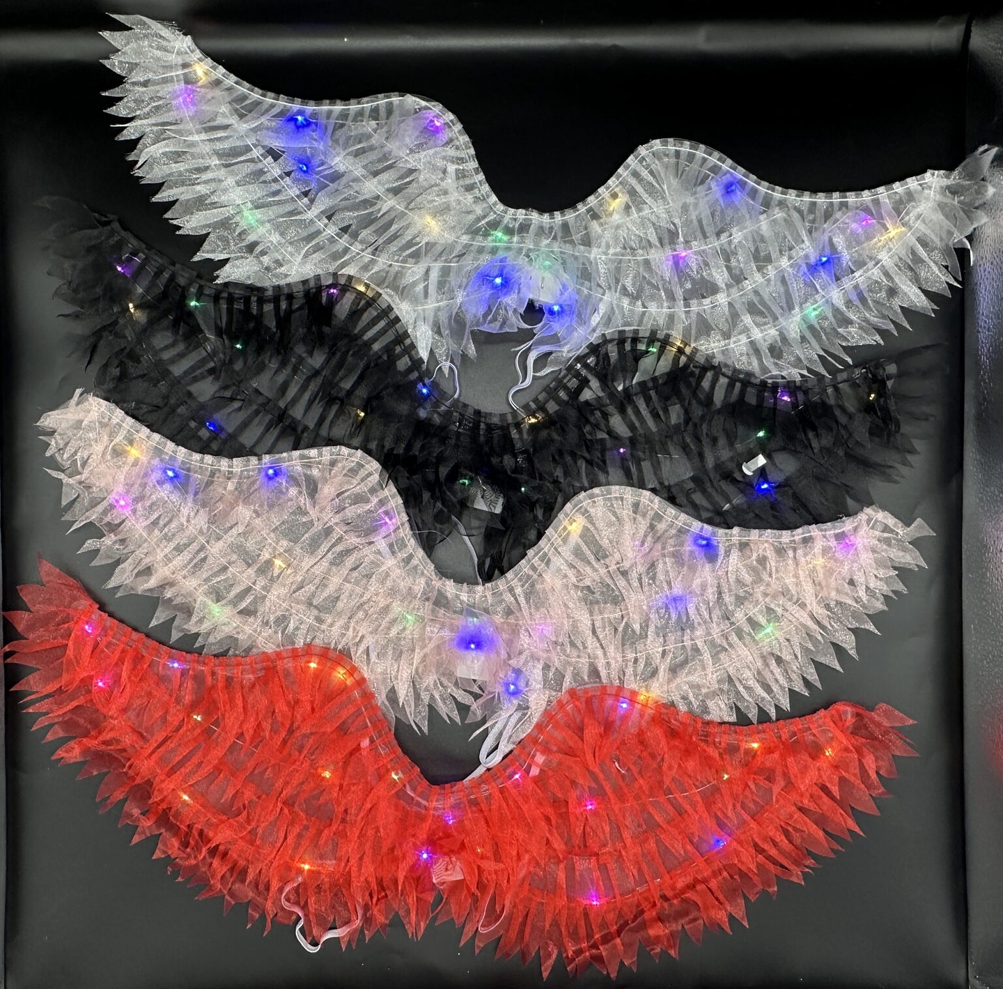 ALAS CON LUZ COLORES 21x63CM 7