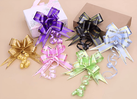 CINTA DE REGALO MÁGICA MOÑO 1.6x34CMS PQT 10 UNDS POR CO