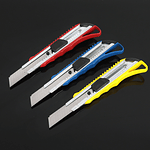 CORTA CARTON CALIDAD COLORES 18CM