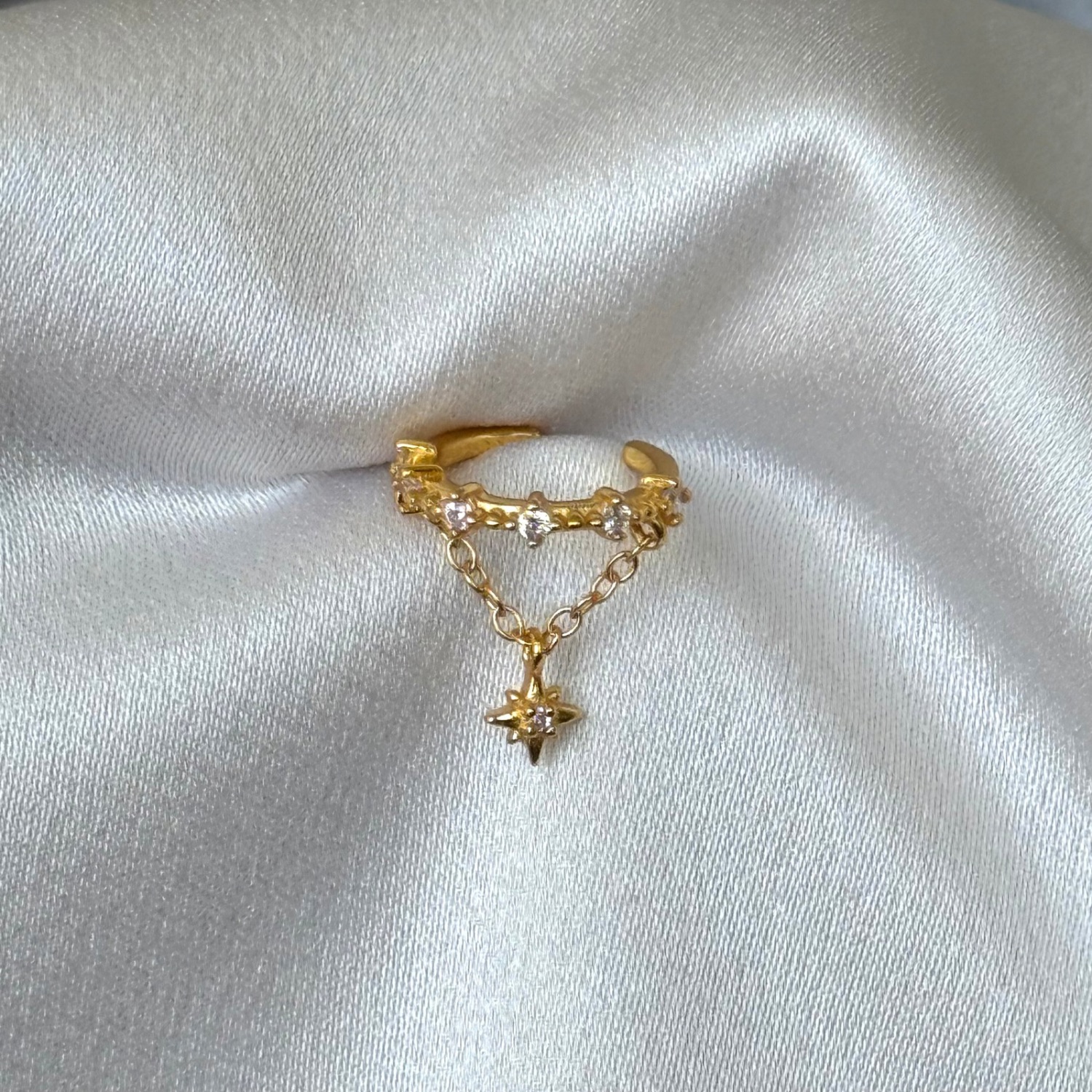 Cuff estrella colgante