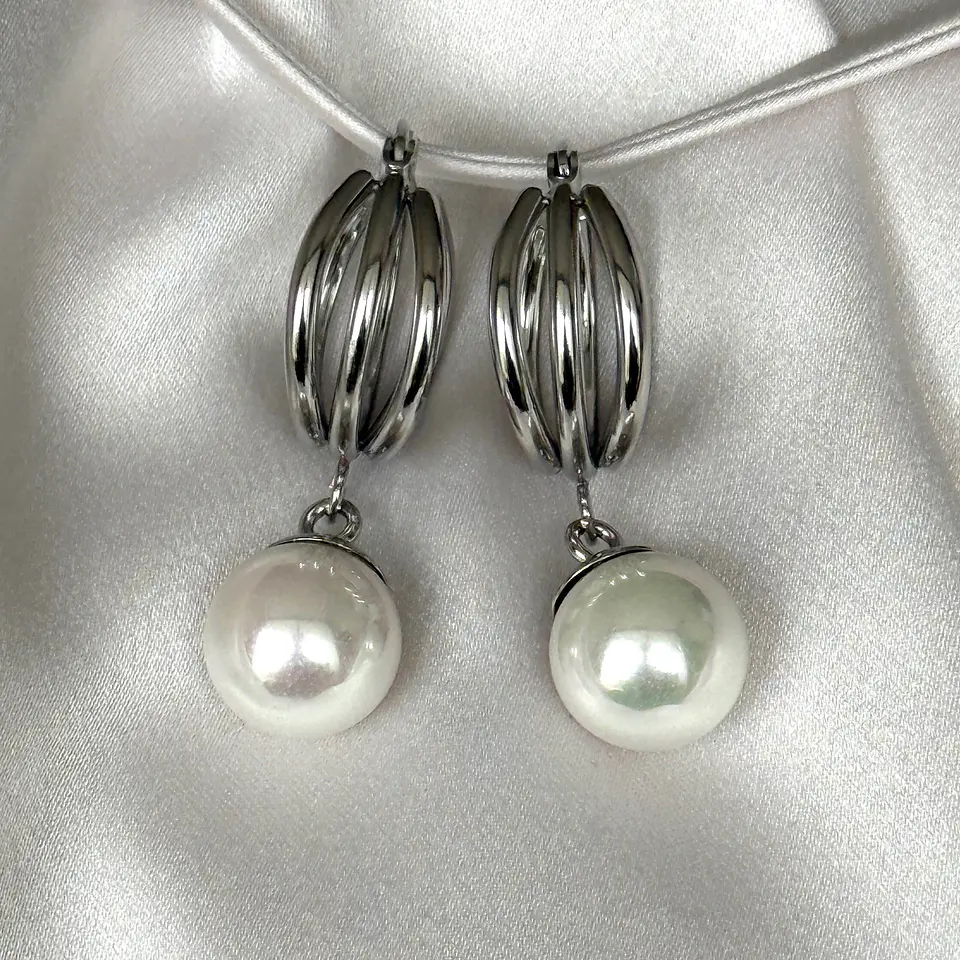 Argollas triples con perla a.q. 1