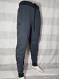 PANTALÓN BUZO GRIS UNDER ARMOUR TALLA 2XL - Miniatura 1