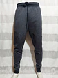 PANTALÓN BUZO GRIS UNDER ARMOUR TALLA 2XL - Miniatura 2