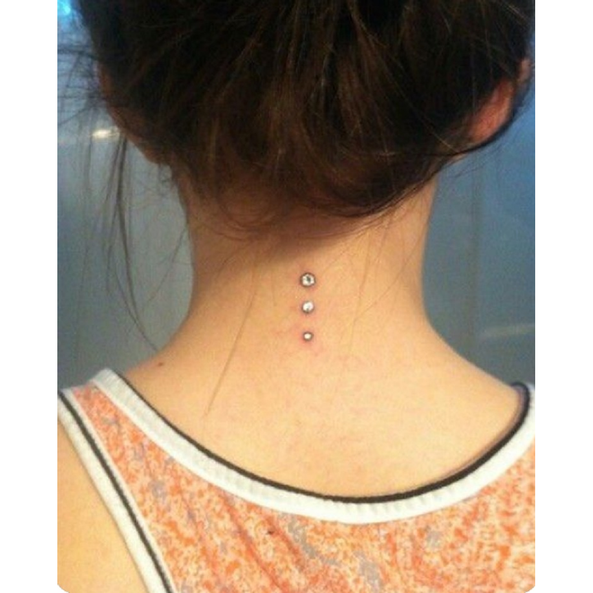 piercing en la espalda