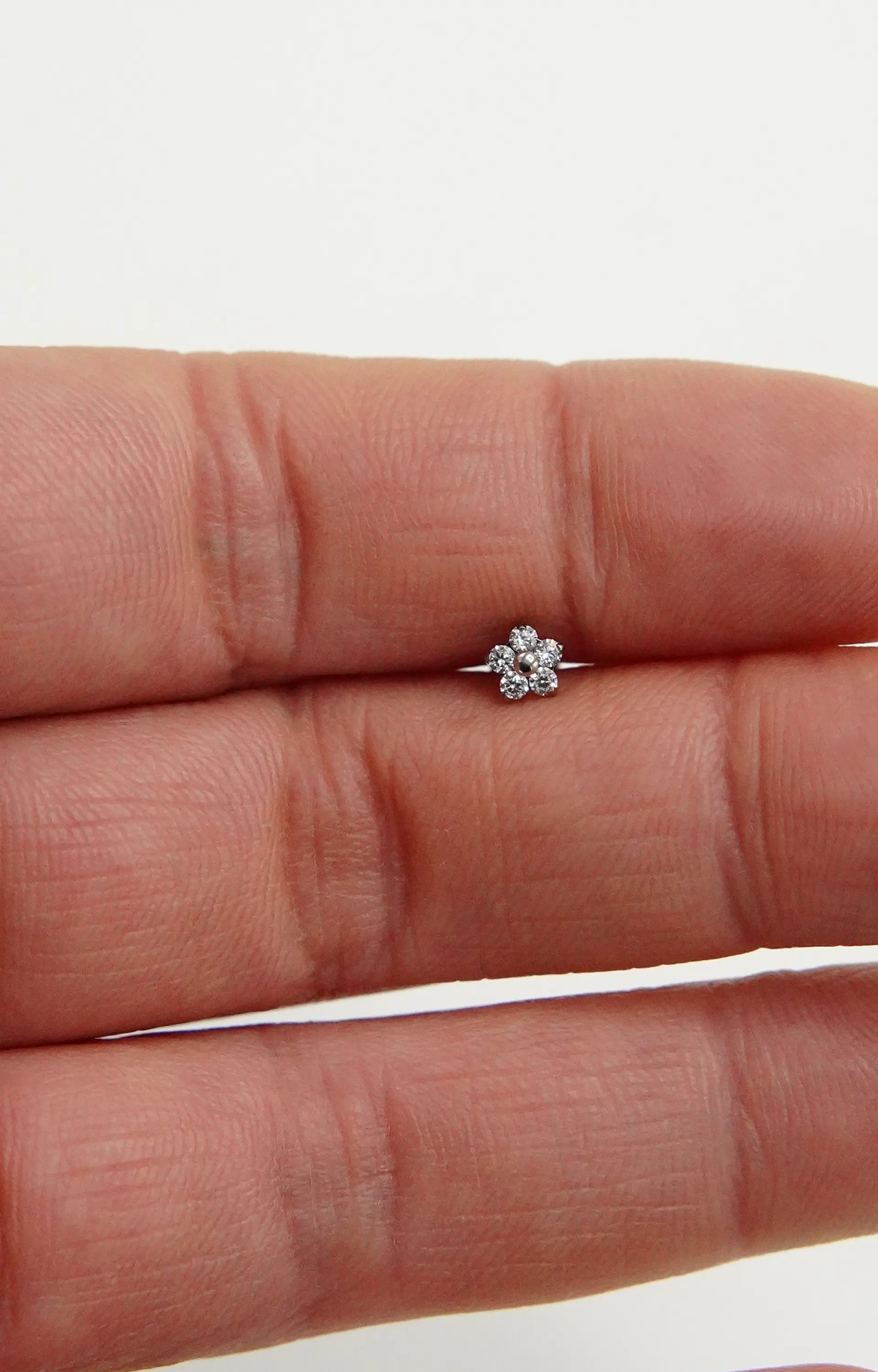 Aros flor titanio zirconia ASTM F136 plateados 9