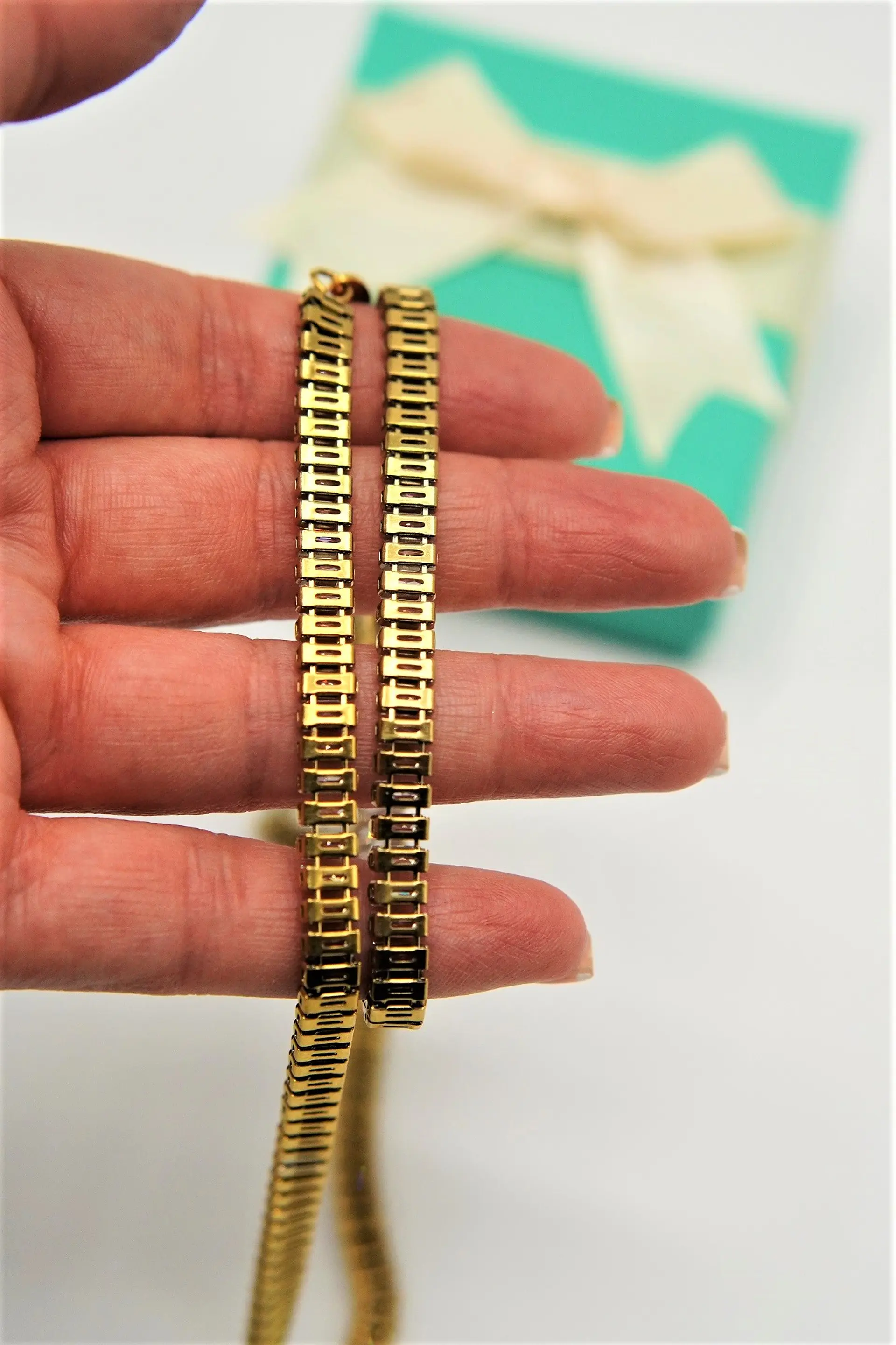 Conjunto de collar y pulsera tennis chapada en oro 18k 11