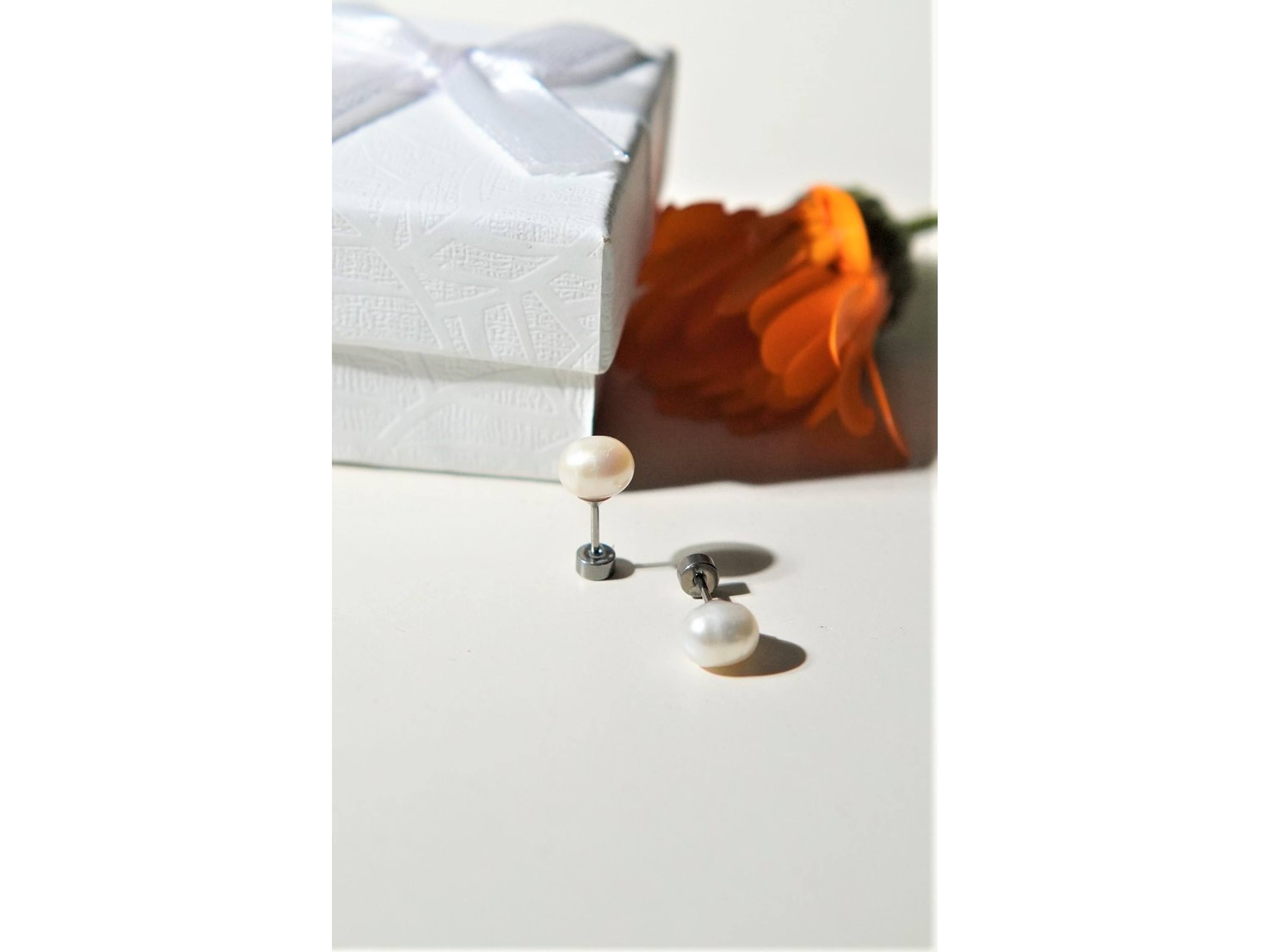 Aros Muriel perlas de rio 7mm titanio ASTM F136 Riviere 5