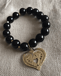 Pulsera piedra natural de  Onix Negro con dije de corazón 