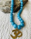 Collar calipso con dije OM - Serenidad y Vibracion universal