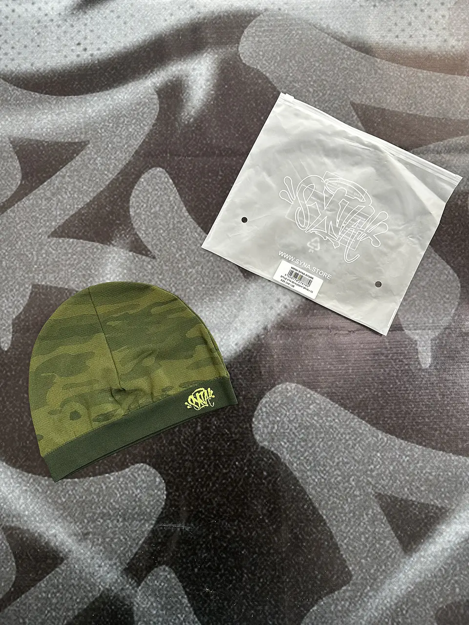 skull cap syna - camo green and readactive logo 1