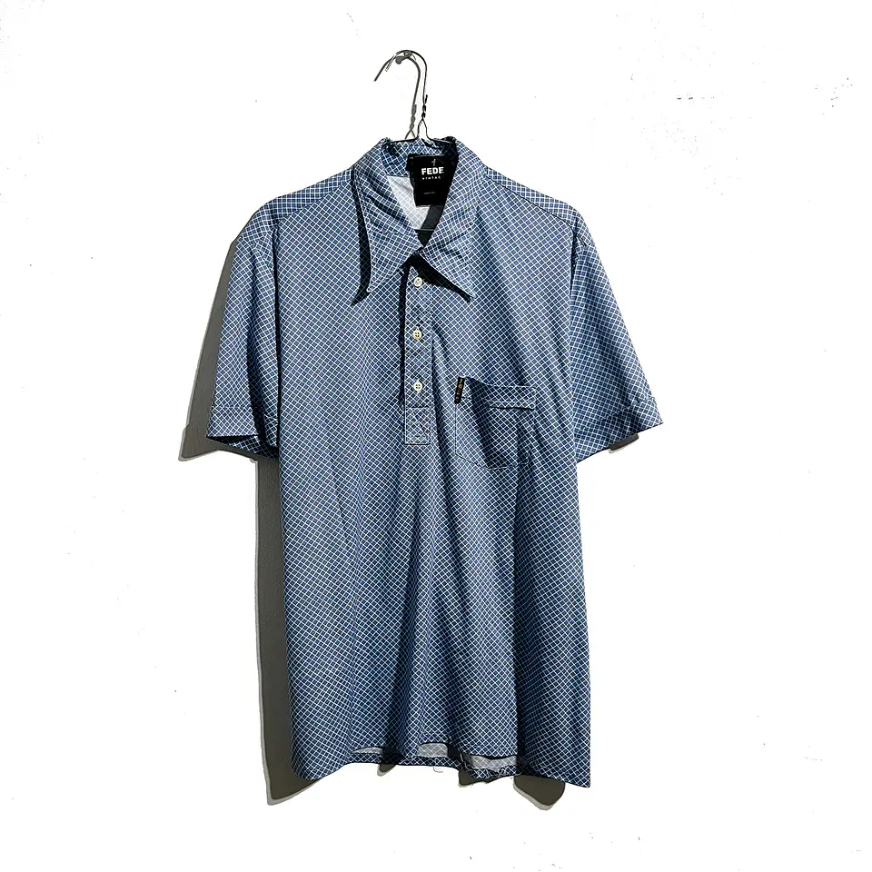 POLERA GOLF VINTAGE CELESTE ROMBOS 1