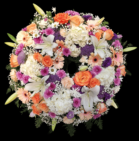 Corona de condolencias pastel y morado