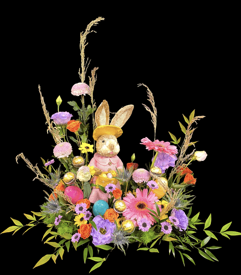 Bosque primavera con conejo de pascua y huevitos  de chocolate 