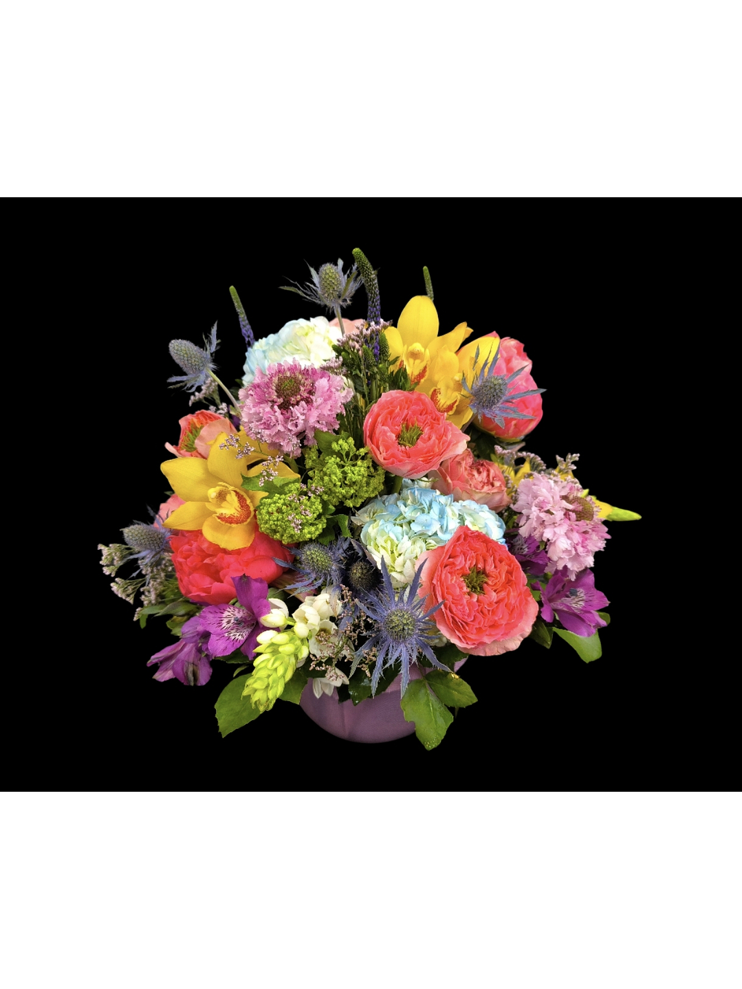 Centro de mesa en tono primaveral en pecera 1