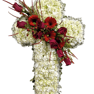 Cruz blanca descanso eterno de hortensias blancas