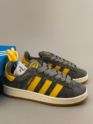 Zapatillas CAM PUS gris líneas amarillas 