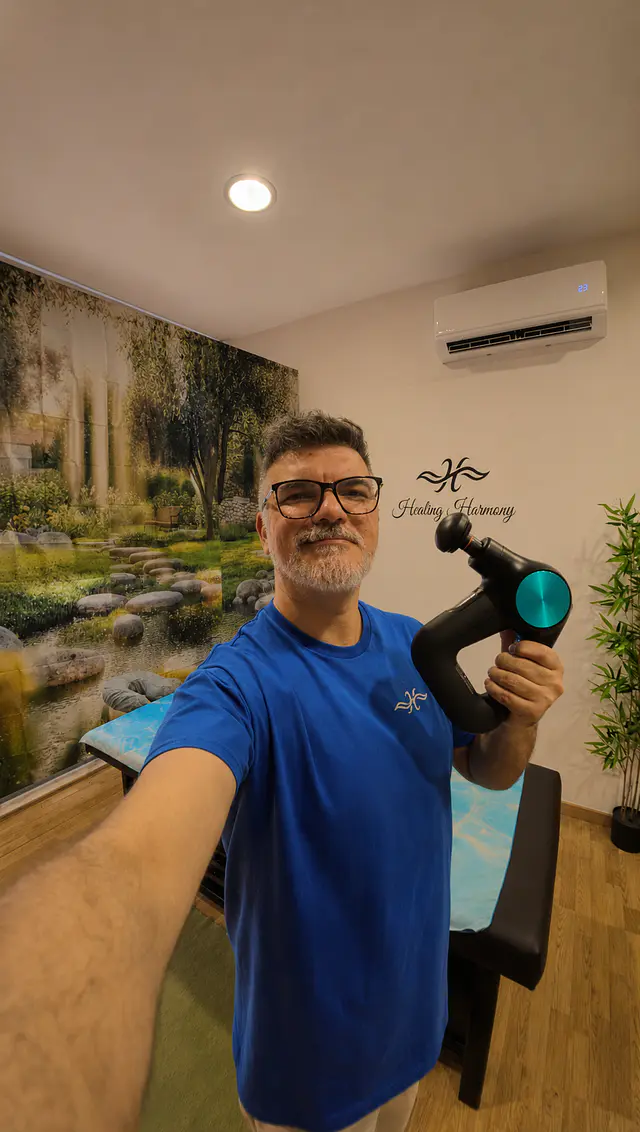 A pistola de massagem