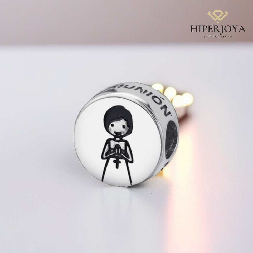 Silver disc charm with a girl in her communion dress. 2