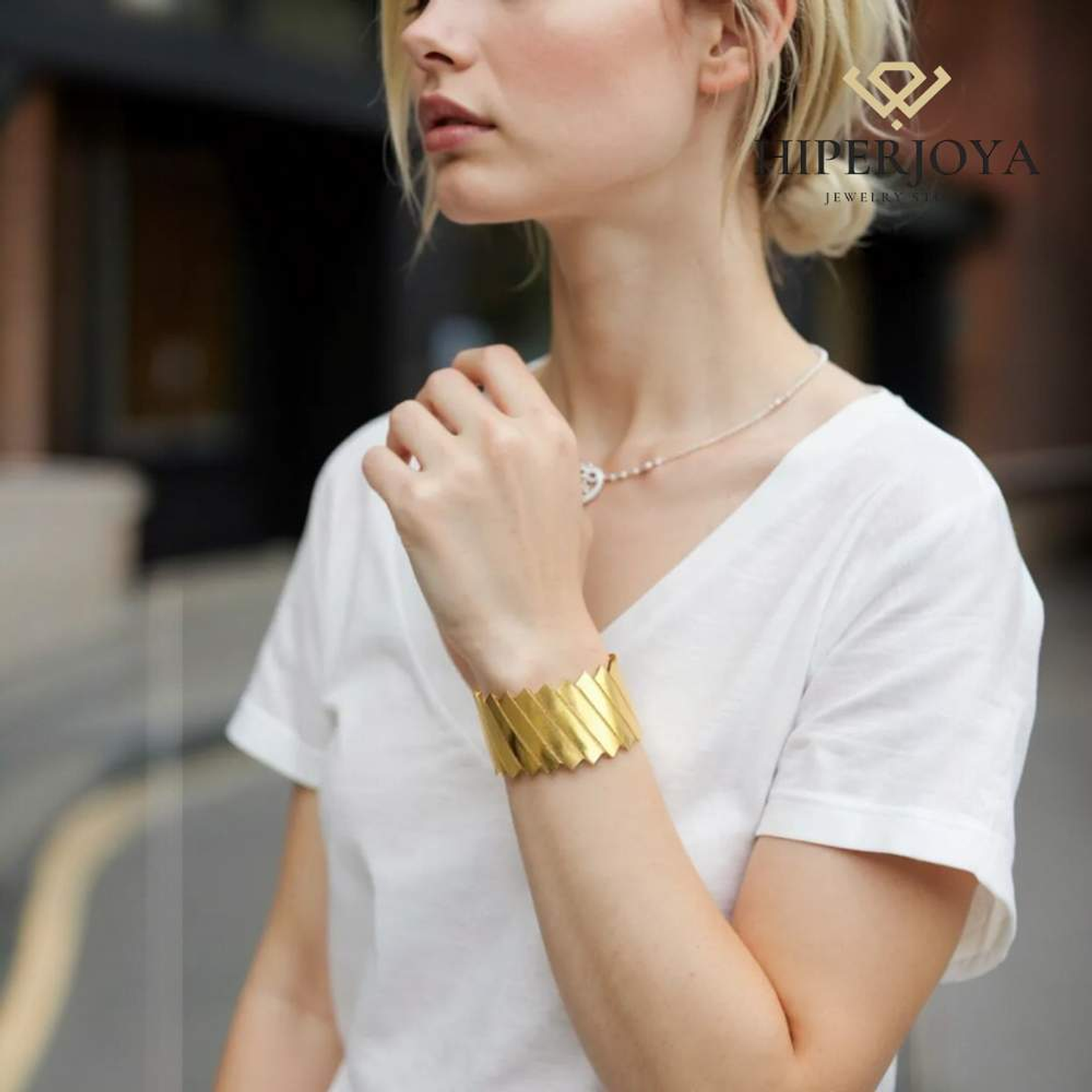 Brazalete de acero con baño de oro barras  2