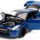 Carro Colección   Nissan GTR 2009 de Brian con figura de Brian y luces de trabajo, Rápido y Furioso - Jada Toys 31142 - Modelo de coche de juguete a escala 1/18 - Miniatura 2