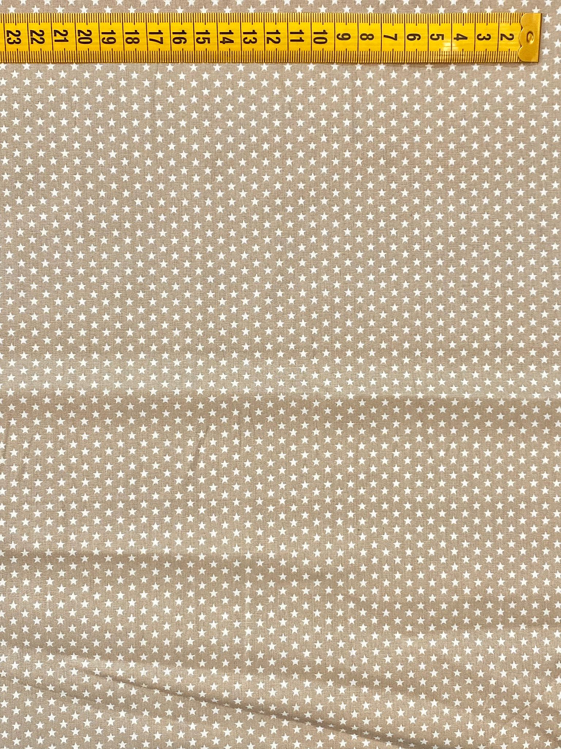 Tecido Bege Com Estrelinhas 1