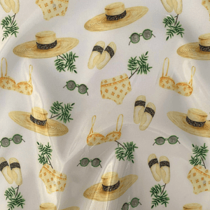 Tecido plastificado com motivos de praia 