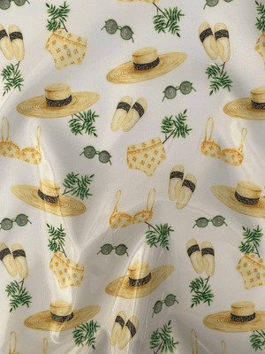 Tecido plastificado com motivos de praia 