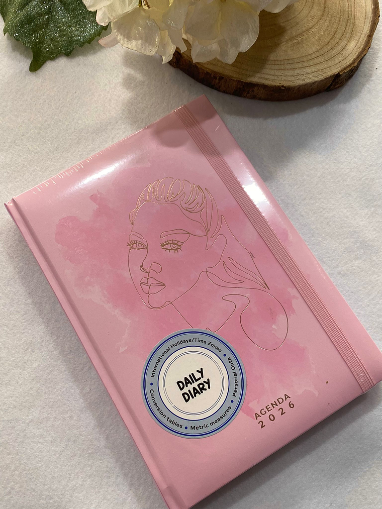 Agenda rosa com rosto dourado 2026 1