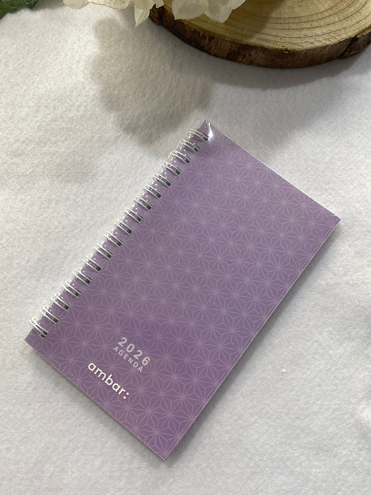Agenda roxa com figuras geométricas 2026 1